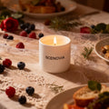 Berry Rose scented candle, lit candle close-up