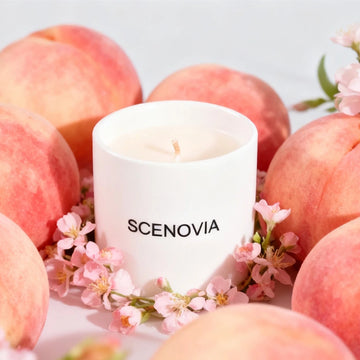 Wild Peach Bush scented candle, lit candle close-up