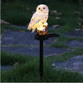 solar owl garden lamps, garden landscape, dusk